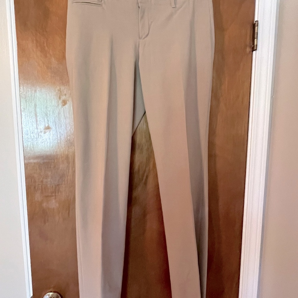 Woman’s tan dress pants.
